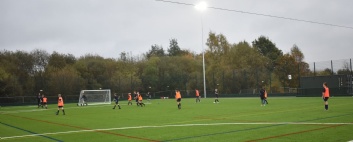 Pupils playing football on the Astroturf
